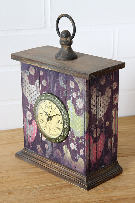Clock with decorative motif pullets