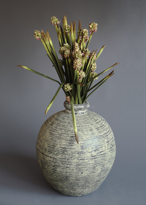 Arrangement of permanent value (artificial flowers+ vase)