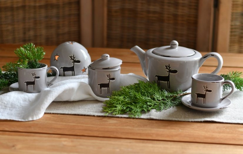 cup and saucer with reindeer - ceramics