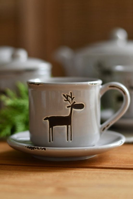 cup and saucer with reindeer - ceramics
